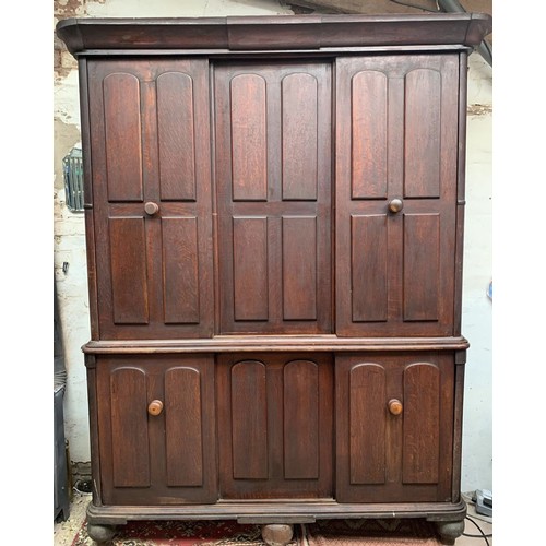 19th century stained oak housekeeper's cupboard with sliding doors, 166 x 55 x 221cm tall (splits into 2 sections).