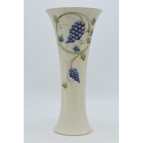 90C - William Moorcroft 'Grape' lustre trumpet vase, 24.5cm tall (professionally restored).