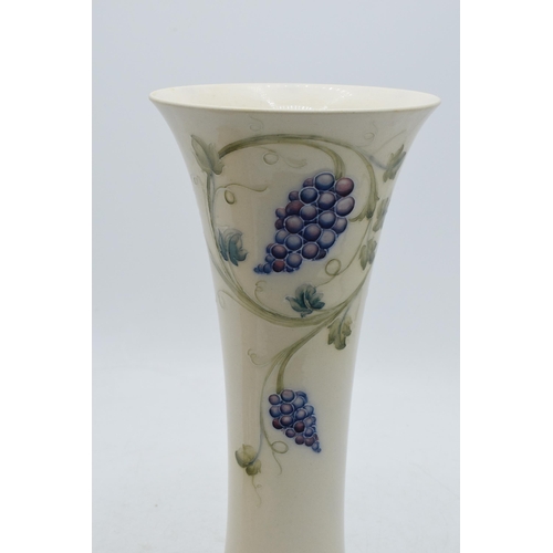 90C - William Moorcroft 'Grape' lustre trumpet vase, 24.5cm tall (professionally restored).