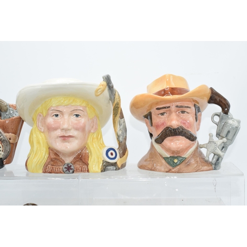 120E - Royal Doulton character jugs from the Wild West series to include Annie Oakley, Wyatt Earp, Doc Holl... 