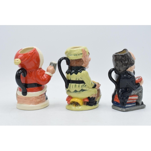 120H - A trio of Royal Doulton Toby jugs to include Charles Dickens D6997, Leprechaun D6948 and Father Chri... 