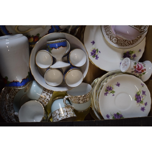 144 - A collection of tea ware in floral patterns to include a Royal Crown Derby Derby Posies jug, Gladsto... 