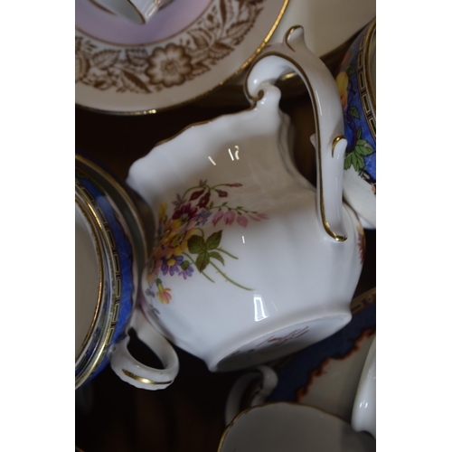 144 - A collection of tea ware in floral patterns to include a Royal Crown Derby Derby Posies jug, Gladsto... 