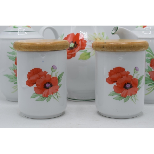 150 - Royal Worcester Poppies tea ware to include 2 teapots, a vase and 2 storage jars (5).