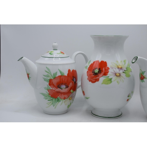 150 - Royal Worcester Poppies tea ware to include 2 teapots, a vase and 2 storage jars (5).