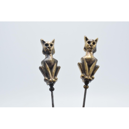 179 - Pair of vintage brass and steel cat hatpins, 22cm long