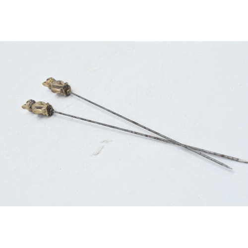 179 - Pair of vintage brass and steel cat hatpins, 22cm long