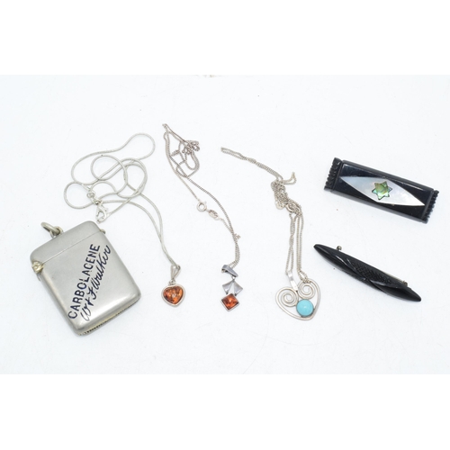 183 - A trio of silver jewellery with turquoise and faux amber pendants, Whitby Jet bar brooches and a met... 