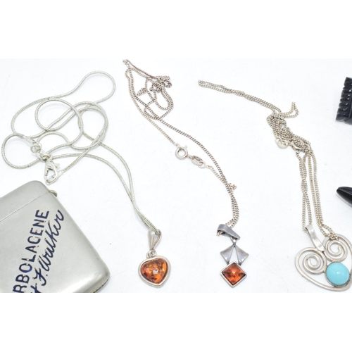 183 - A trio of silver jewellery with turquoise and faux amber pendants, Whitby Jet bar brooches and a met... 