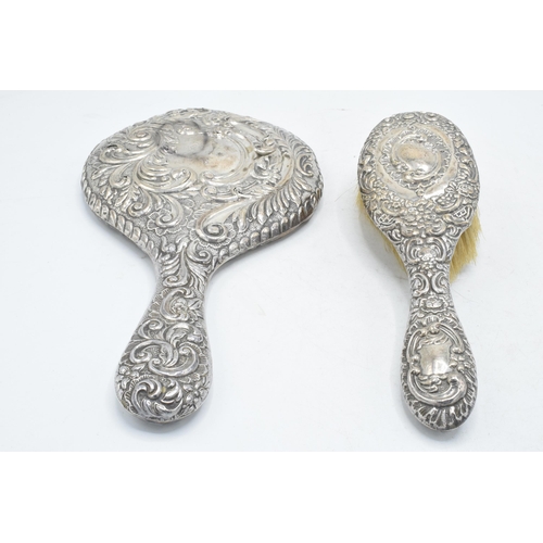 184A - A hallmarked silver hand mirror, together with silver handled brush and other items to include potte... 