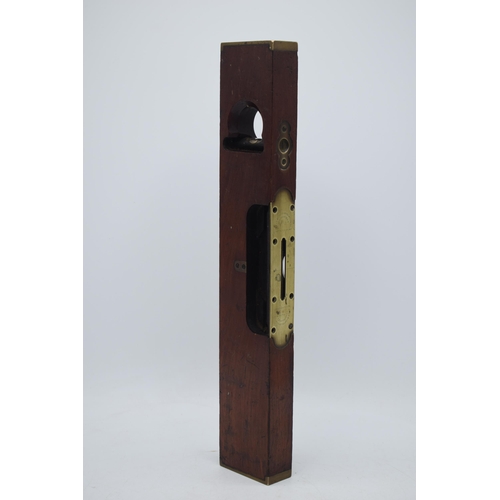 15'' L L Davis salesman sample / display model of a model no.6 mahogany spirit level. Top plate marked with patent of March 17th 1867 and the maker's name. Another brass plate marked '6', 38cm long.