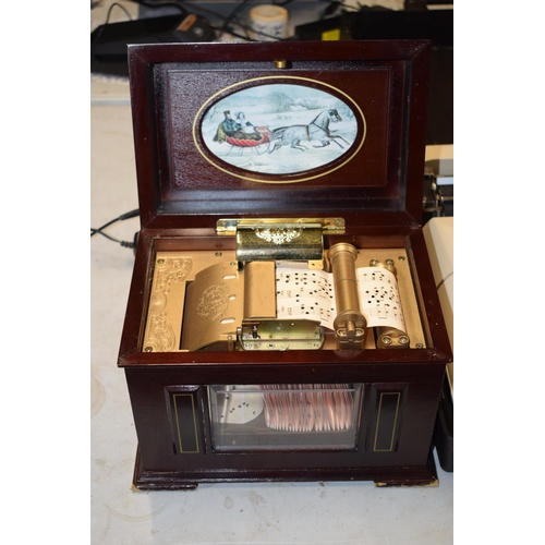 318 - Cased Olivetti Lettera 35 vintage typewriter and a modern decorative music box (2).