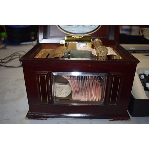 318 - Cased Olivetti Lettera 35 vintage typewriter and a modern decorative music box (2).