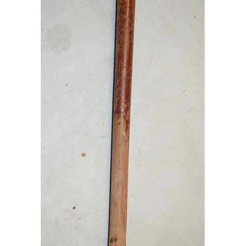 322A - Unusual malacquer (or similar) walking cane with bronze moulded putti handle, 87cm long.