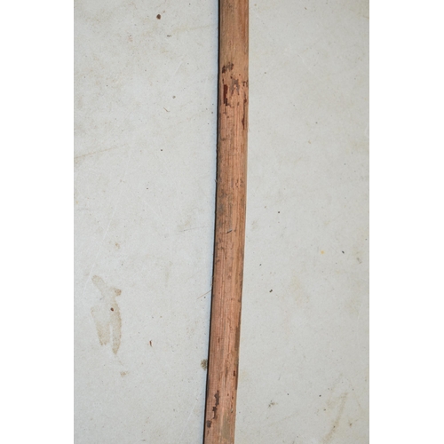 322A - Unusual malacquer (or similar) walking cane with bronze moulded putti handle, 87cm long.