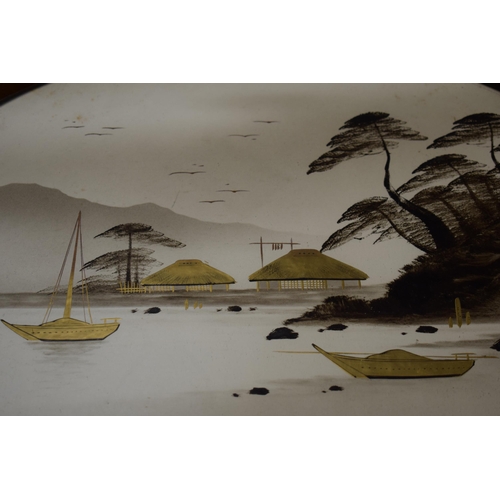 325 - A pair of 20th century mahogany framed oriental pictures of ships sailing on water amongst mountains... 