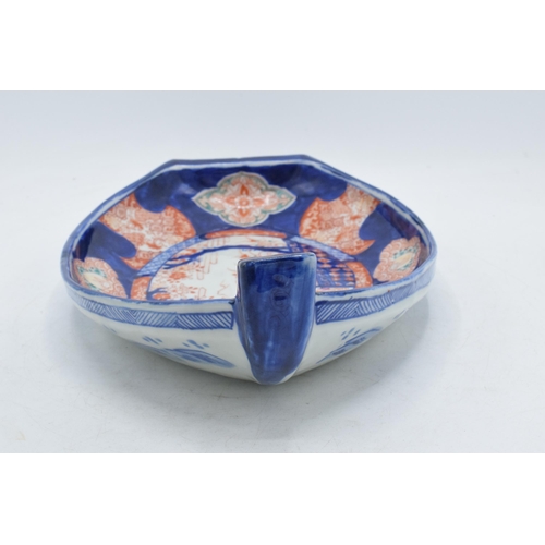 328 - 19th century Imari pottery dish in the form of a shallow boat with traditional scenes, 32cm long.