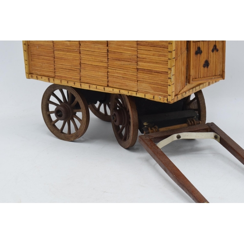 330 - Vintage matchstick model of a gypsy caravan, 26cm long exc stretchers.