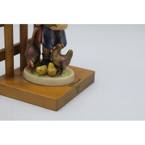 34 - A pair of Goebel / Hummel bookends on wooden bases to include Little Goat Herder No.250 and Feeding ... 