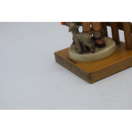 34 - A pair of Goebel / Hummel bookends on wooden bases to include Little Goat Herder No.250 and Feeding ... 