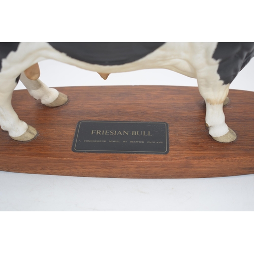 74 - Beswick Friesian Bull A2580 on wooden base.