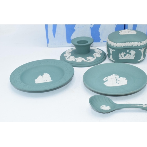 88 - Wedgwood Jasperware in teal: to include a pair of candlesticks, a spoon, a trinket, vases etc (9).