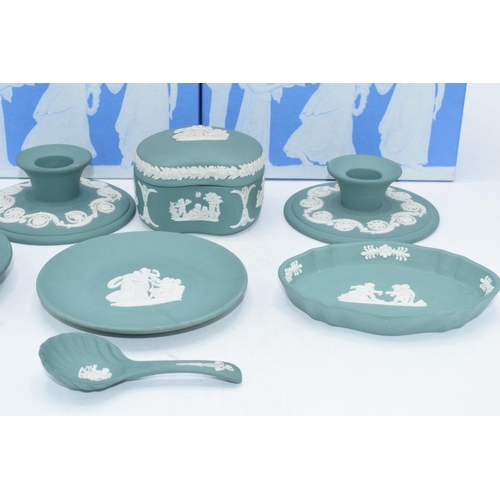 88 - Wedgwood Jasperware in teal: to include a pair of candlesticks, a spoon, a trinket, vases etc (9).