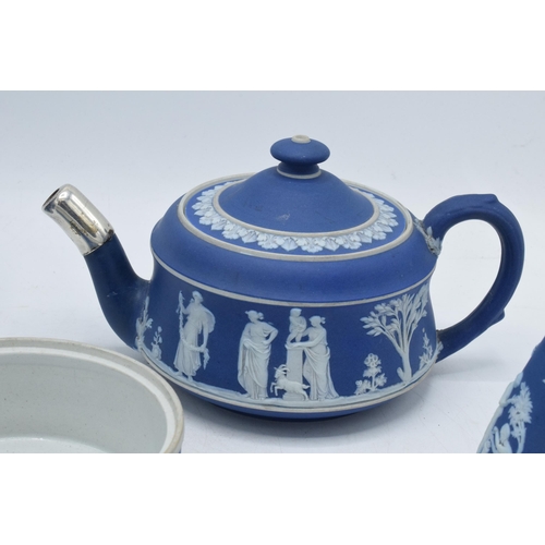 88B - 19th century and later Wedgwood Jasperware in dip / dark blue: to include a teapot, water jugs, a va... 