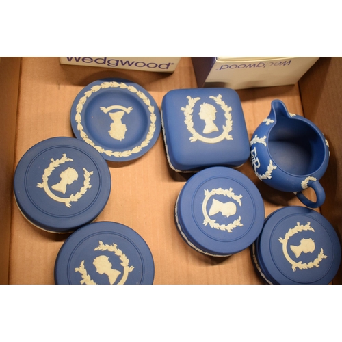 88D - Wedgwood Jasperware in Royal Blue: to include commemorative pieces such as trinkets, a milk jug and ... 