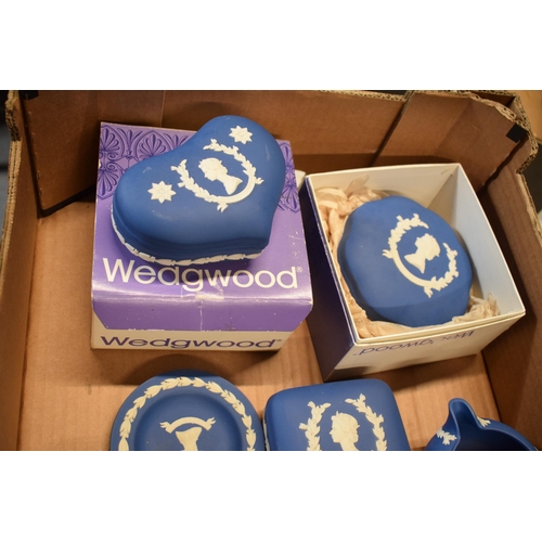 88D - Wedgwood Jasperware in Royal Blue: to include commemorative pieces such as trinkets, a milk jug and ... 