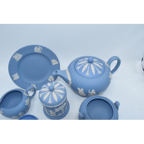 88I - Wedgwood Jasperware in Blue: to include a teapot,milk, lidded sugars, trinket and miniatures .