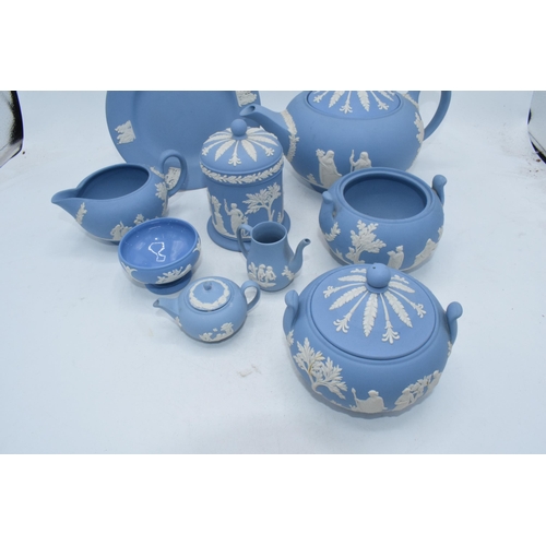 88I - Wedgwood Jasperware in Blue: to include a teapot,milk, lidded sugars, trinket and miniatures .