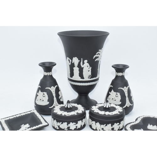 93 - Wedgwood Jasperware in Black: to include a large 18cm vase, trinkets, bud vases and pin dishes (9).