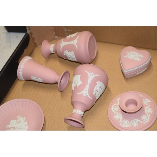 94 - Wedgwood Jasperware in Pink: to include vases, candlesticks and pin dishes (12).