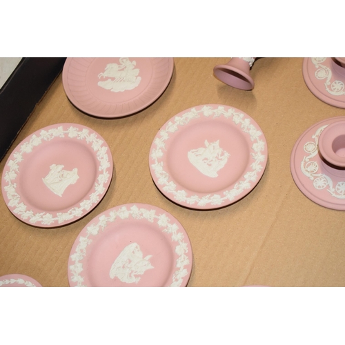 94 - Wedgwood Jasperware in Pink: to include vases, candlesticks and pin dishes (12).