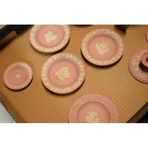 94 - Wedgwood Jasperware in Pink: to include vases, candlesticks and pin dishes (12).