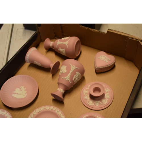 94 - Wedgwood Jasperware in Pink: to include vases, candlesticks and pin dishes (12).