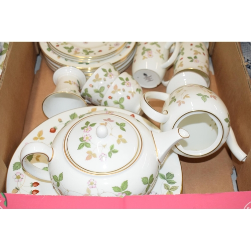 158 - A large collection of Wedgwood Wild Strawberry tea and dinner ware to include a teapot, a coffee pot... 