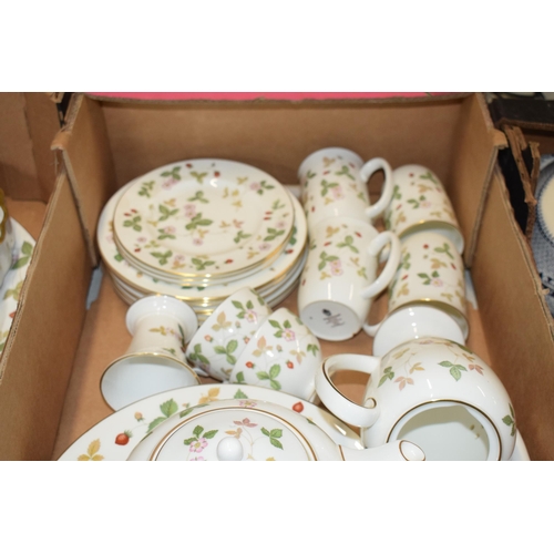 158 - A large collection of Wedgwood Wild Strawberry tea and dinner ware to include a teapot, a coffee pot... 