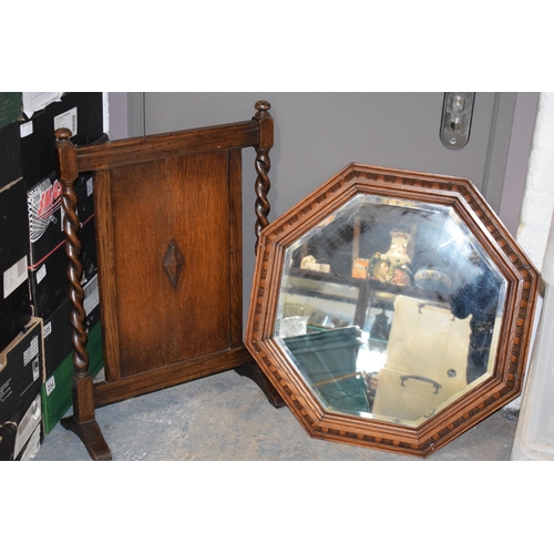 399 - 1930s octagonal oak carved mirror, 63cm diameter, together with a similar fire screen, 72cm tall (2)... 