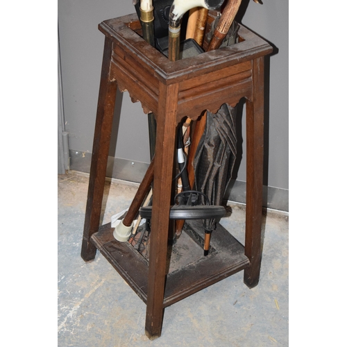 400 - 1930s wooden hall stick stand together with a range of walking sticks, to include country interest, ... 