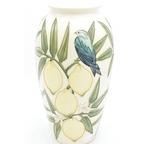 101A - Moorcroft lamp base in the Lemon and Bird pattern, together with a Moorcroft lamp shade, 26.5cm tall... 