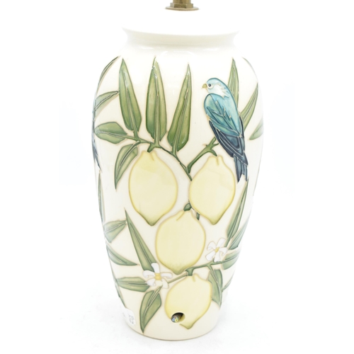 101A - Moorcroft lamp base in the Lemon and Bird pattern, together with a Moorcroft lamp shade, 26.5cm tall... 