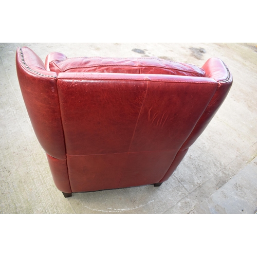 401 - Red leather chesterfield-style leather high-backed arm chair with beaded design, 90x90x97cm tall.