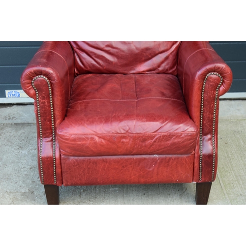 401 - Red leather chesterfield-style leather high-backed arm chair with beaded design, 90x90x97cm tall.