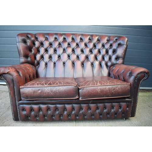 402 - Brown leather Chesterfield-style high-backed 2 seater club sofa with button-back design, 143x90x95cm... 