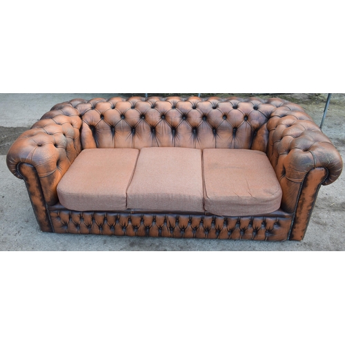 403 - Brown leather deep buttoned Chesterfield three seater sofa with metal beading, 192x98x65cm tall, cus... 