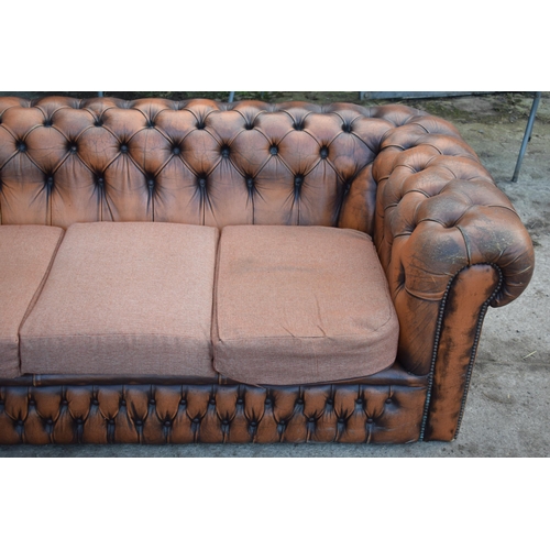 403 - Brown leather deep buttoned Chesterfield three seater sofa with metal beading, 192x98x65cm tall, cus... 