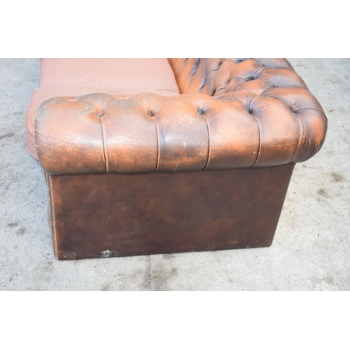 403 - Brown leather deep buttoned Chesterfield three seater sofa with metal beading, 192x98x65cm tall, cus... 