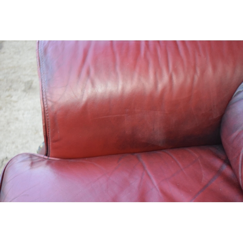 405 - Red oxblood leather Chesterfield-style button-back armchair with metal beading, 110x96x92cm tall.